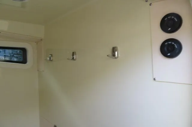 Slide: The Image of Interior of 2025 Chris-Craft Catalina 28 with hooks and gauges. - 29