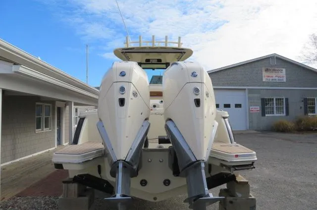 Slide: The Image of 2025 Chris-Craft Catalina 28 with dual outboard engines, parked outdoors. - 3