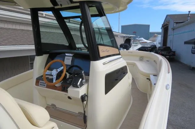 Slide: The Image of 2025 Chris-Craft Catalina 28 boat interior with steering wheel and dashboard. - 31