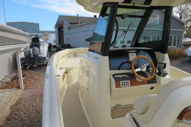 Slide: The Image of 2025 Chris-Craft Catalina 28 boat interior with steering wheel and dashboard. - 32