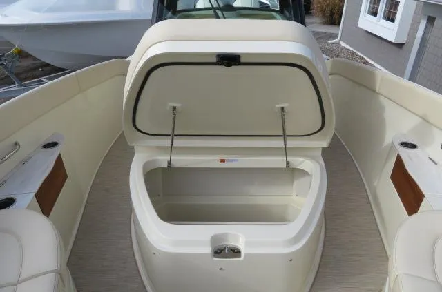 Slide: The Image of 2025 Chris-Craft Catalina 28 boat interior with open storage compartment. - 34