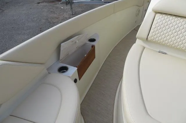 Slide: The Image of 2025 Chris-Craft Catalina 28 interior with beige seating and cup holders. - 37