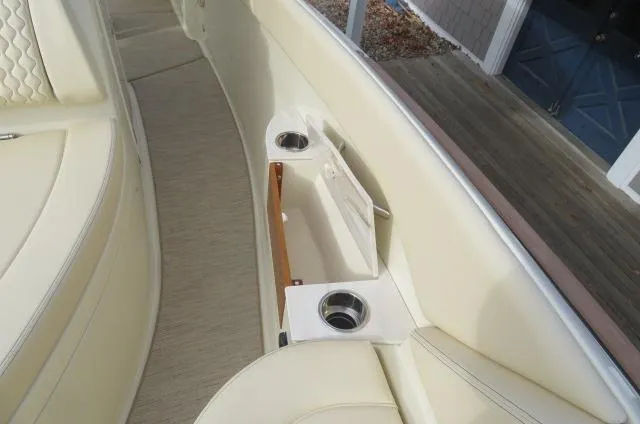 Slide: The Image of 2025 Chris-Craft Catalina 28 interior with cup holders and storage compartment. - 38