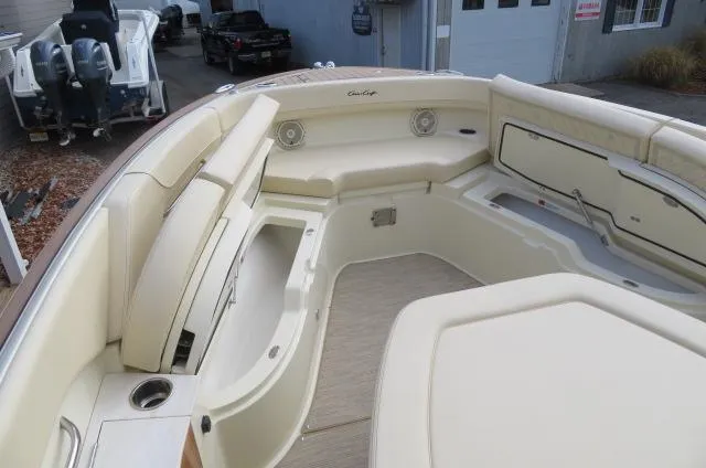 Slide: The Image of 2025 Chris-Craft Catalina 28 boat interior with beige seating and storage compartments. - 40