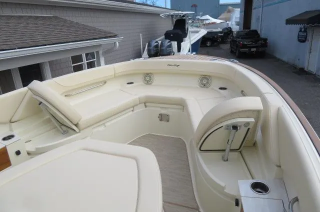 Slide: The Image of 2025 Chris-Craft Catalina 28 boat interior with beige seating and modern design. - 42