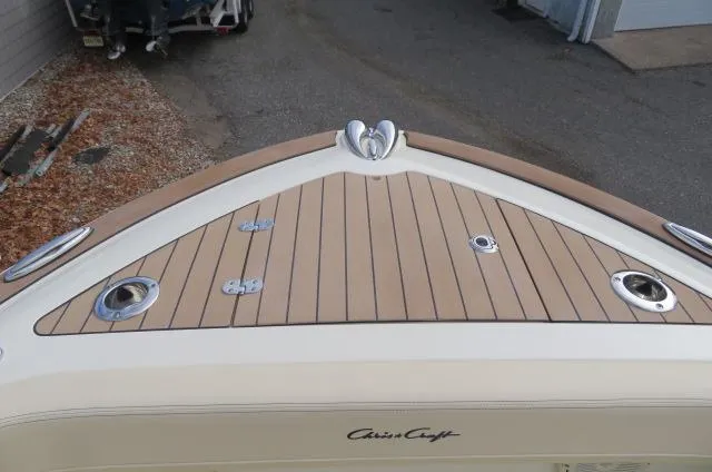 Slide: The Image of Chris-Craft Catalina 28, 2025 model, teak deck detail, elegant design. - 46