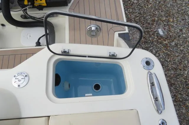 Slide: The Image of Open storage compartment on 2025 Chris-Craft Catalina 28 boat deck. - 6