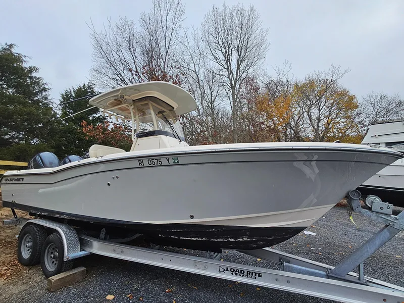 Slide: The Image of 2022 Grady-White Fisherman 257 boat on trailer, parked outdoors in autumn setting. - 1