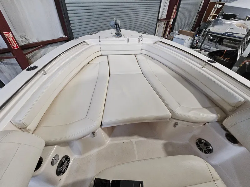 Slide: The Image of 2022 Grady-White Fisherman 257 boat interior with cushioned seating and storage. - 10