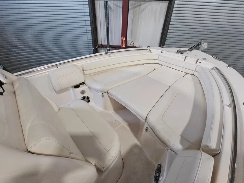 Slide: The Image of 2022 Grady-White Fisherman 257 boat interior with white cushioned seating. - 12