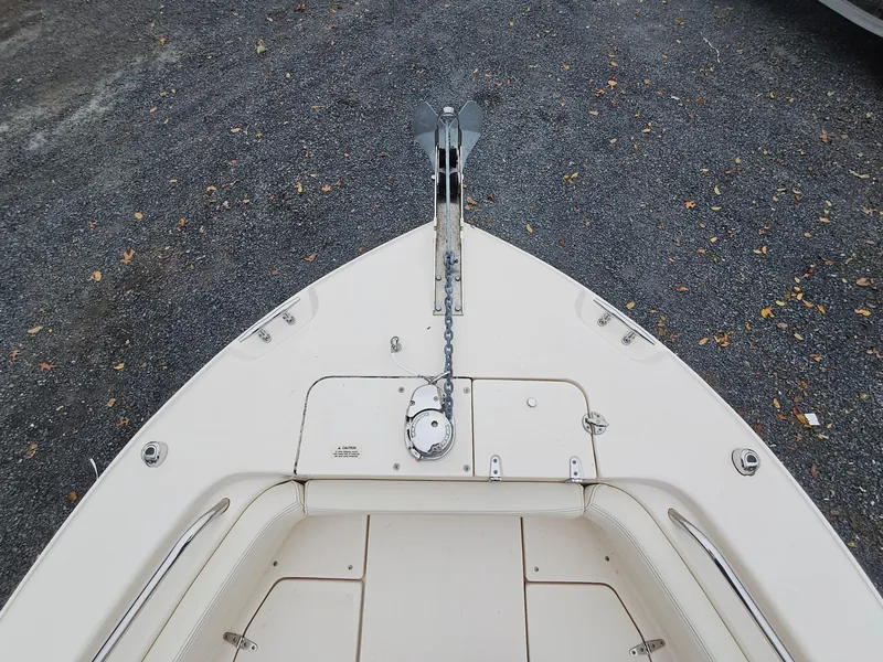 Slide: The Image of 2022 Grady-White Fisherman 257 boat bow with anchor and chain on gravel. - 13