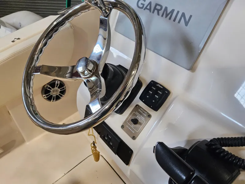 Slide: The Image of Steering wheel and controls of 2022 Grady-White Fisherman 257 boat with Garmin system. - 8