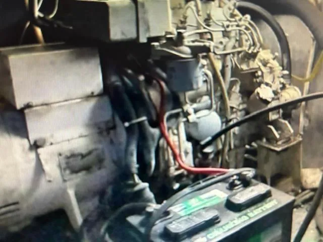 Slide: The Image of Engine room of a 1977 Bertram 58 Motor Yacht with visible battery and wiring. - 20