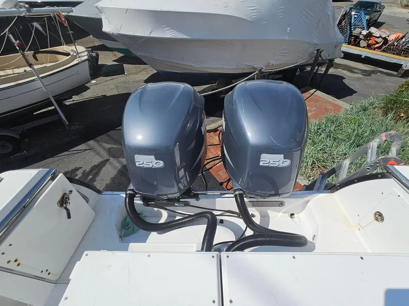 Slide: The Image of Twin 250 horsepower engines on a 2007 Southport 26 Center Console boat. - 12