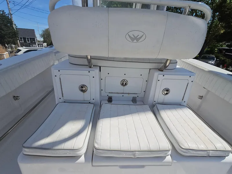 Slide: The Image of 2007 Southport 26 Center Console boat interior with cushioned seating and storage compartments. - 15