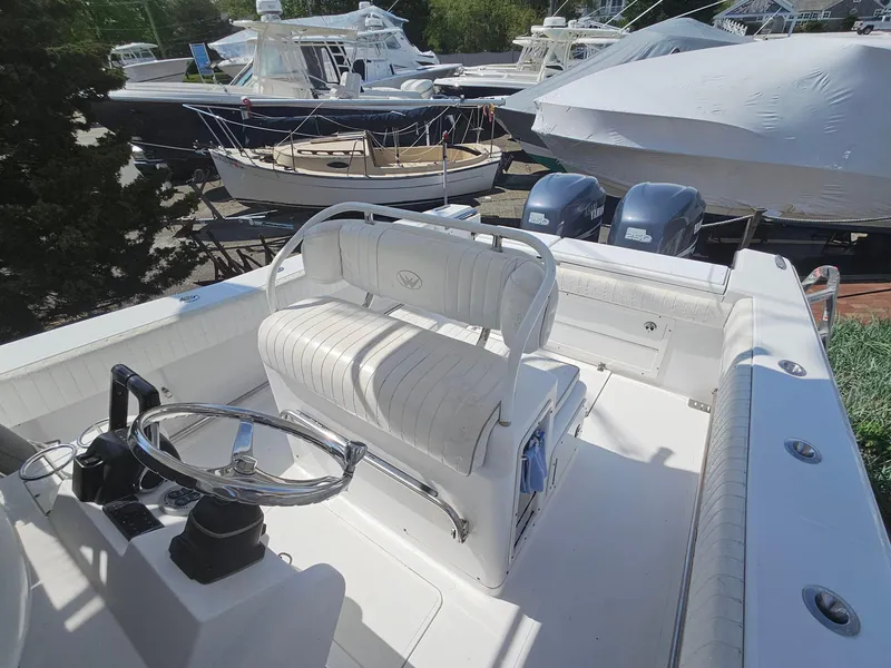 Slide: The Image of 2007 Southport 26 Center Console boat with dual engines and white seating. - 18