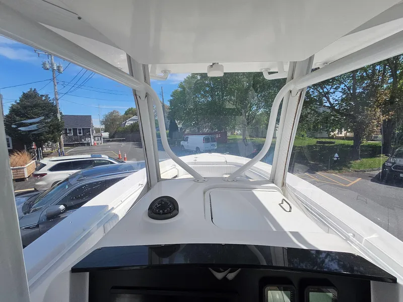 Slide: The Image of 2007 Southport 26 Center Console boat interior view with windshield and dashboard. - 22