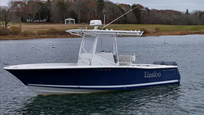 Slide: The Image of 2007 Southport 26 Center Console boat on calm water, side view. - 30