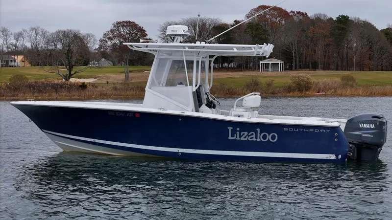Slide: The Image of 2007 Southport 26 Center Console boat on water with Yamaha engine. - 32