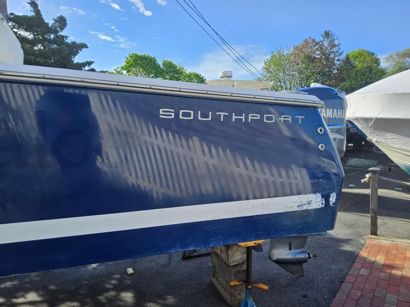 Slide: The Image of Blue 2007 Southport 26 Center Console boat on a stand, outdoors. - 4