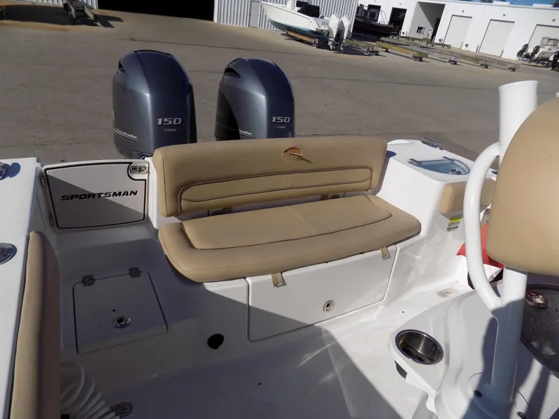 Slide: The Image of 2017 Sportsman Heritage 251 Center Console boat with dual 150 engines and beige seating. - 13