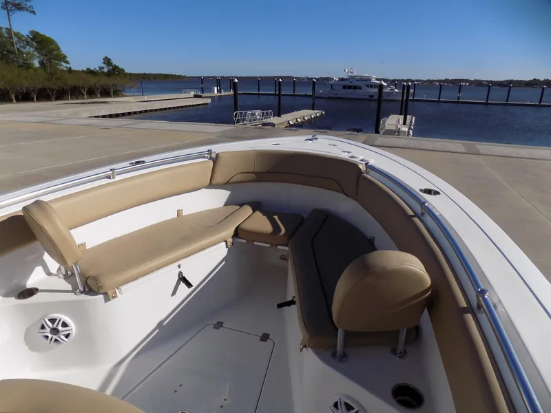 Slide: The Image of 2017 Sportsman Heritage 251 Center Console boat at dock, featuring spacious seating and scenic waterfront. - 15