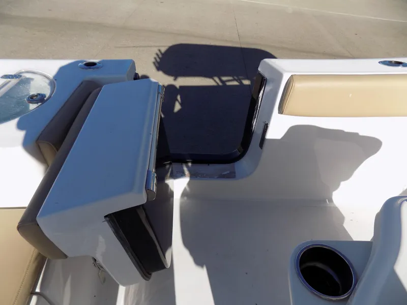 Slide: The Image of 2017 Sportsman Heritage 251 Center Console boat interior with seating and cup holder. - 19