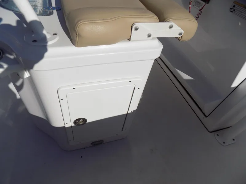 Slide: The Image of 2017 Sportsman Heritage 251 Center Console boat seat and storage compartment. - 20