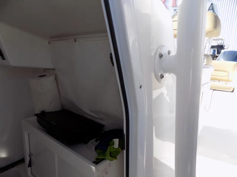 Slide: The Image of 2017 Sportsman Heritage 251 Center Console interior storage compartment. - 26