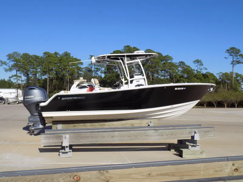 Slide: The Image of 2017 Sportsman Heritage 251 Center Console boat on display outdoors. - 27