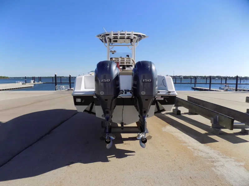 Slide: The Image of 2017 Sportsman Heritage 251 Center Console with twin 150 engines at a dock. - 4