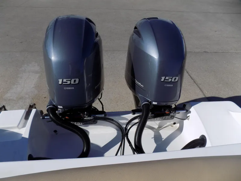 Slide: The Image of Twin Yamaha 150 engines on 2017 Sportsman Heritage 251 Center Console boat. - 5