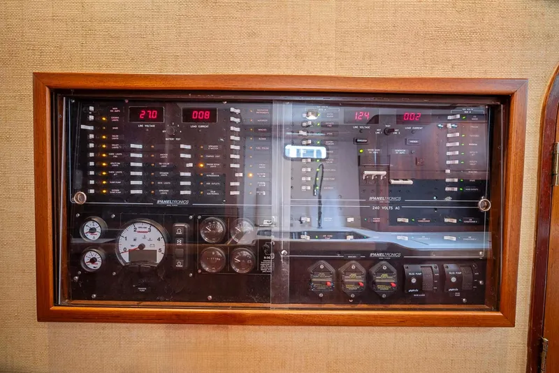 Slide: The Image of Control panel of a 1981 Pearson 530 yacht with gauges and switches. - 16