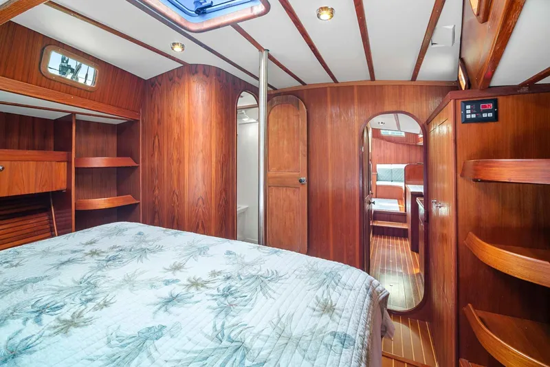 Slide: The Image of Interior of 1981 Pearson 530 yacht with wood paneling and cozy bedroom. - 19