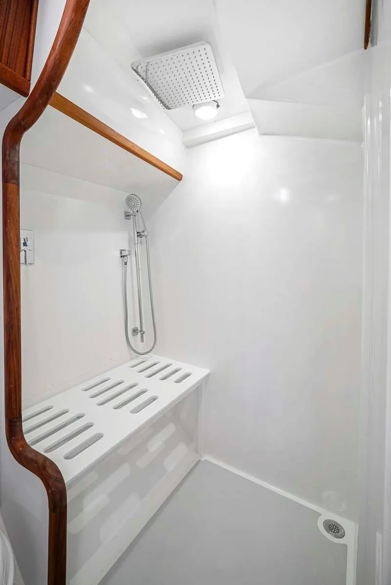 Slide: The Image of 1981 Pearson 530 yacht shower with modern fixtures and wooden accents. - 21