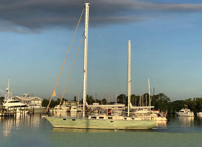 Slide: The Image of 1981 Pearson 530 sailboat docked in a serene marina setting. - 27