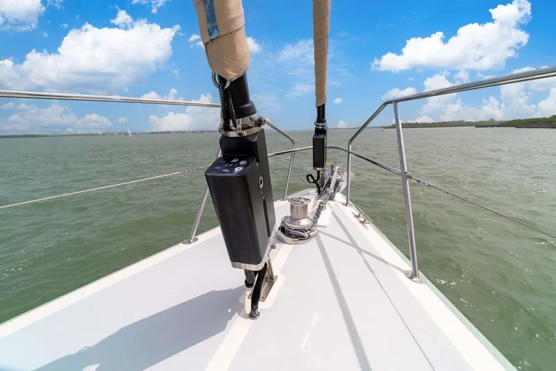 Slide: The Image of Pearson 530 sailboat deck, 1981 model, cruising on calm waters under a blue sky. - 32