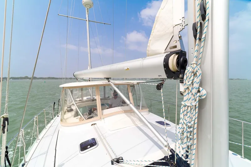 Slide: The Image of Pearson 530 sailboat from 1981 on calm waters under a clear blue sky. - 35