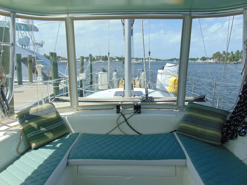 Slide: The Image of Pearson 530 sailboat cockpit view, 1981 model, docked with scenic waterfront background. - 45