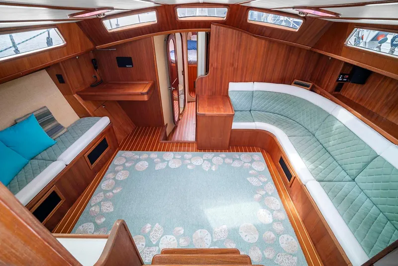 Slide: The Image of Interior of 1981 Pearson 530 yacht with wood paneling and cozy seating. - 7