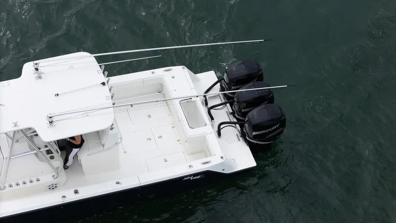 Slide: The Image of 2015 SeaVee 340Z boat with triple outboard engines on water. - 10