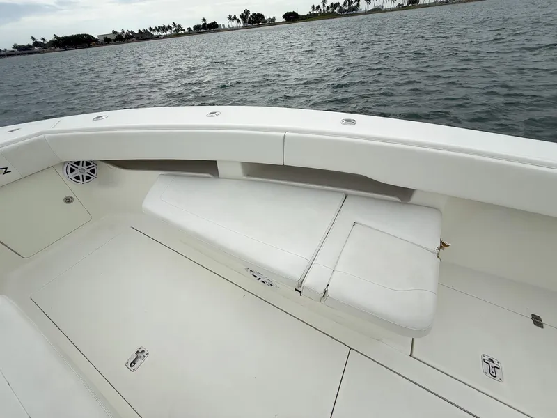 Slide: The Image of 2015 SeaVee 340Z boat interior with white seating, ocean view in background. - 16