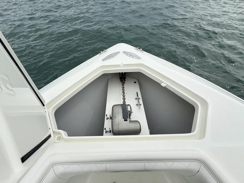 Slide: The Image of 2015 SeaVee 340Z boat anchor compartment on calm water. - 17