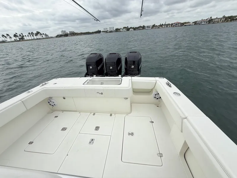 Slide: The Image of 2015 SeaVee 340Z boat with triple engines on open water. - 22