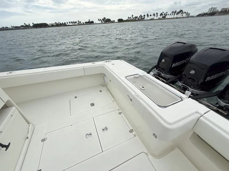 Slide: The Image of 2015 SeaVee 340Z boat with dual Mercury engines on open water. - 25