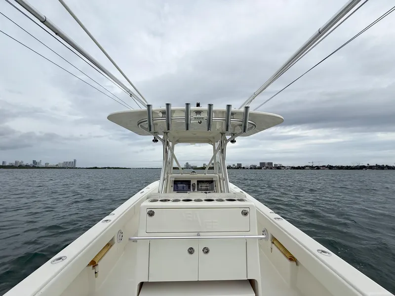 Slide: The Image of 2015 SeaVee 340Z boat on open water under cloudy skies. - 28