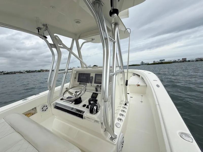 Slide: The Image of 2015 SeaVee 340Z boat interior with steering console on open water. - 29