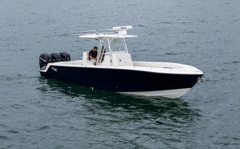 Slide: The Image of 2015 SeaVee 340Z boat on water with triple outboard engines. - 5
