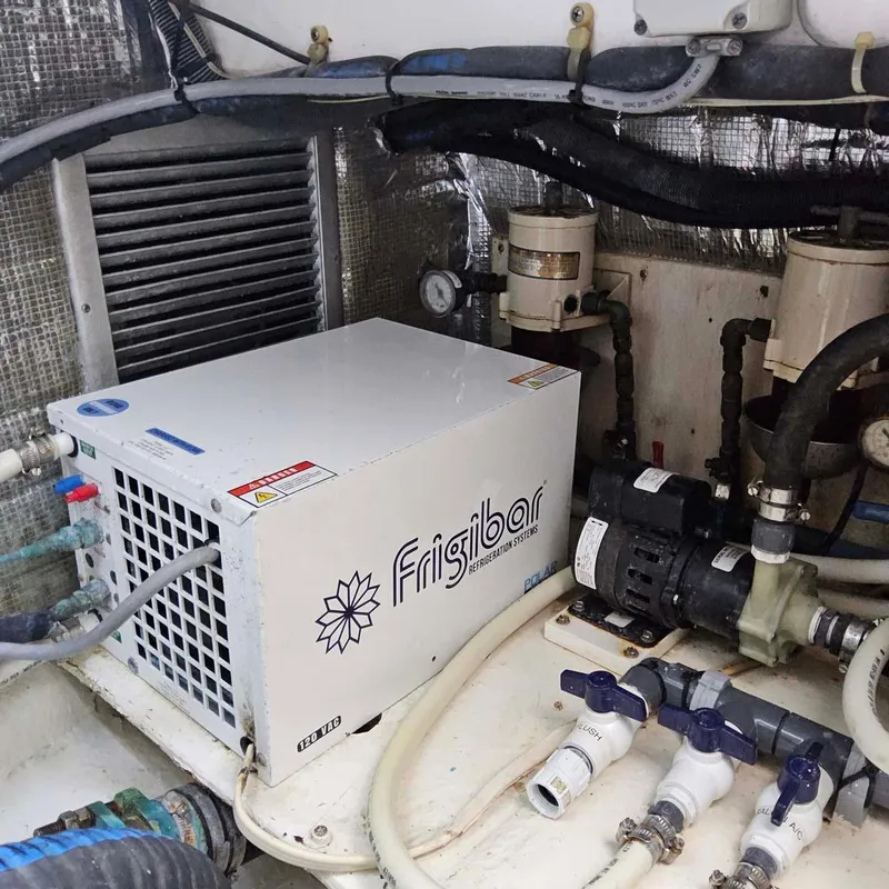 Slide: The Image of Engine room of 2000 Ocean Yachts Super Sport with Frigibar refrigeration unit. - 14