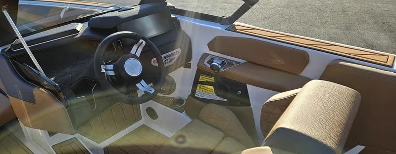 Slide: The Image of 2025 Nautique Super Air Nautique GS22 interior with sleek design and modern controls. - 8